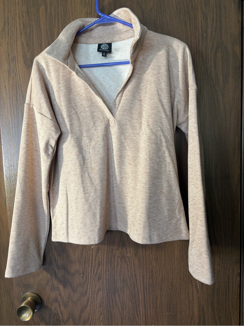 Bobeau soft fleece pullover features a beige color and a V Neck neckline